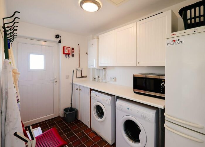 The utility room at Nantucket, a Highcliffe Holidays cottage in Polzeath, Cornwall.