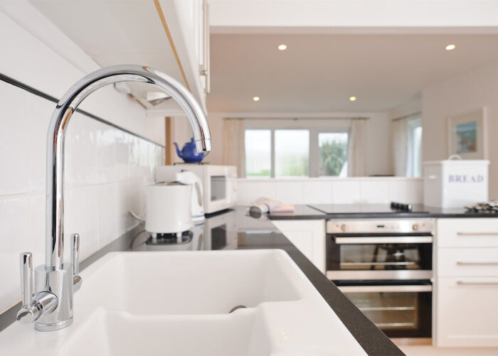 The modern kitchen in the Highcliffe Holidays' cottage Streatfeild.